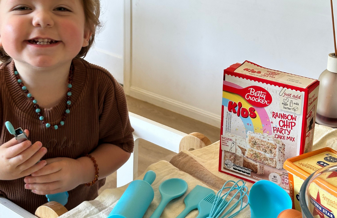 Child Making Cake while standing on Learning Tower