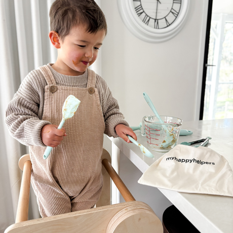 Toddler with cooking Set