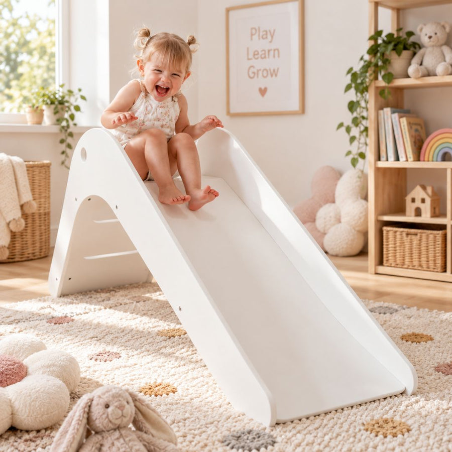 Child playing with wooden indoor kids slides at home
