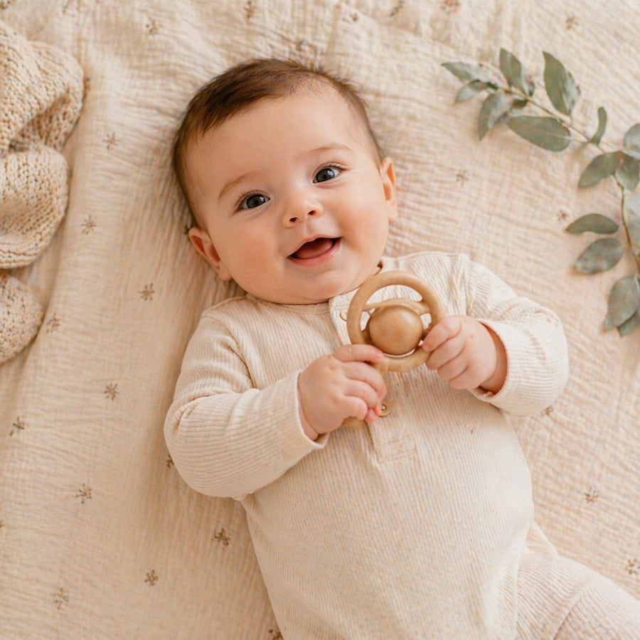 Baby Rattles shown in a nursery setting