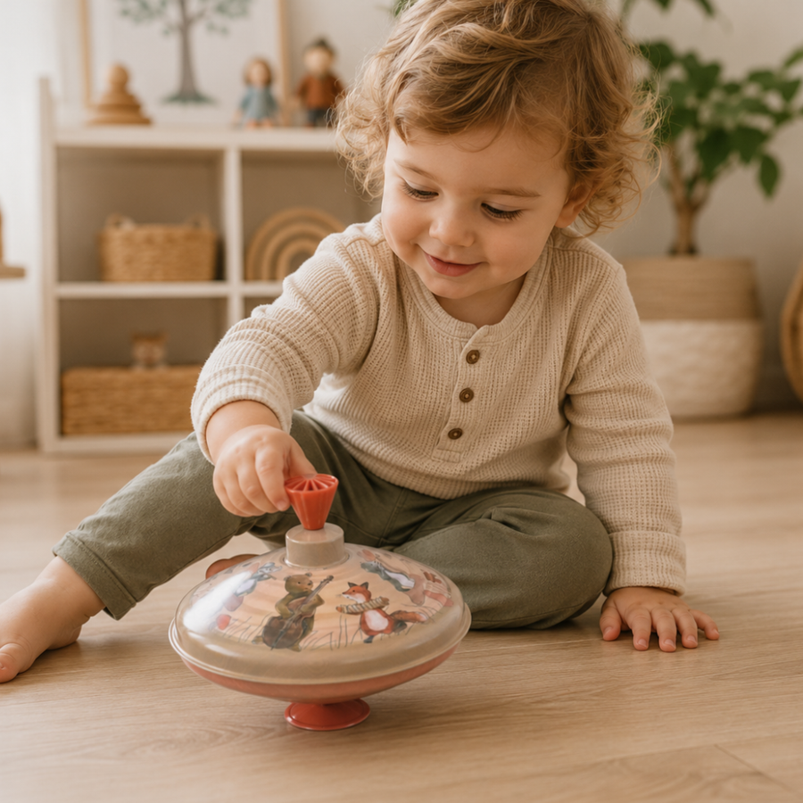 Young child exploring spinning tops for toddlers