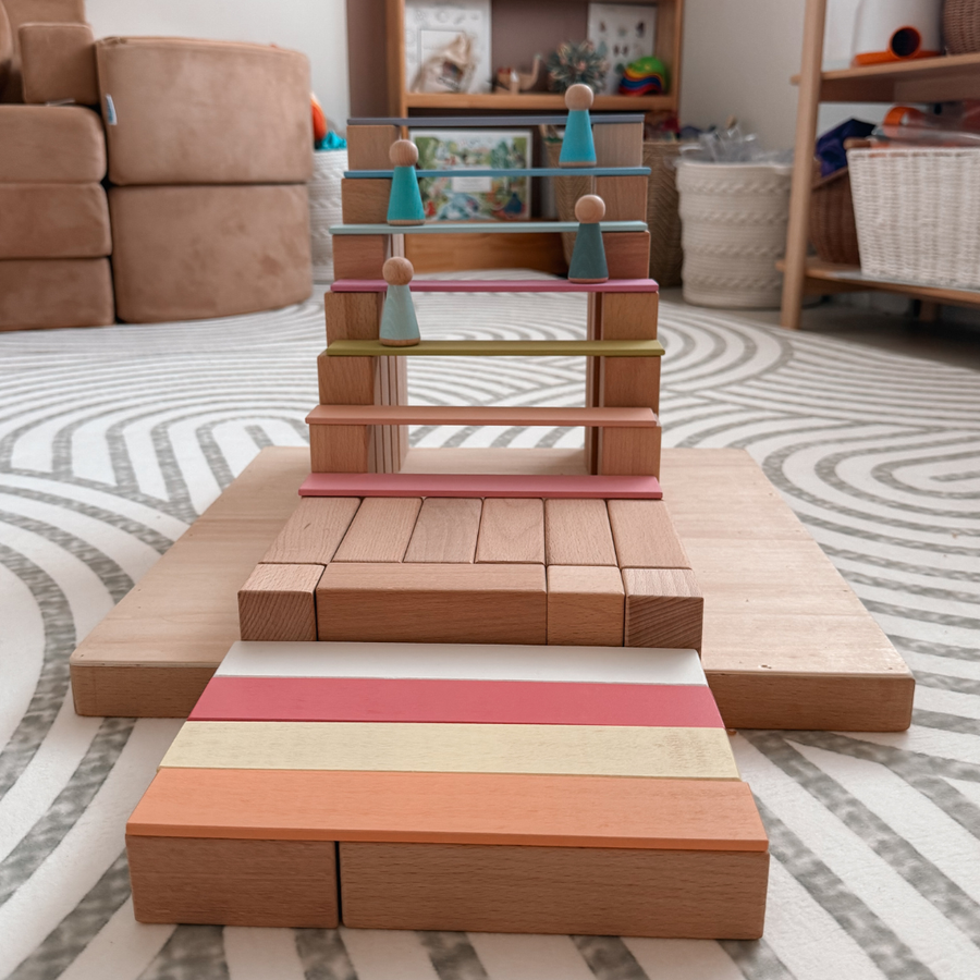 Child playing with stacking blocks at home
