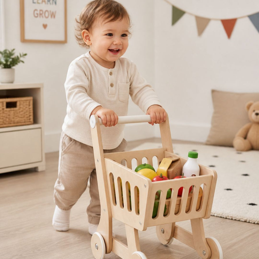 Child playing with kids shopping trolleys at home