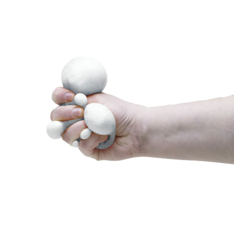 NeeDoh Snow Ball Crunch Stress Ball being squeezed and stretched