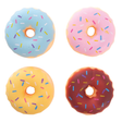 Four colorful donut-shaped objects with sprinkles on a white background