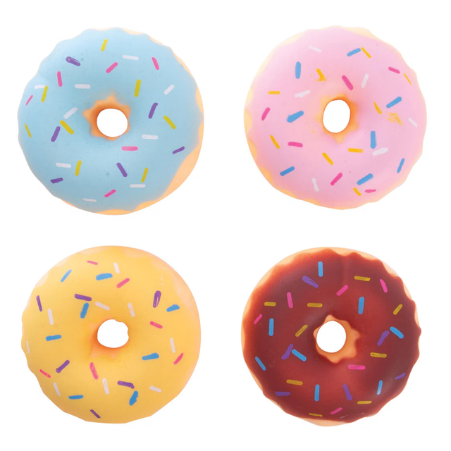 Four colorful donut-shaped objects with sprinkles on a white background