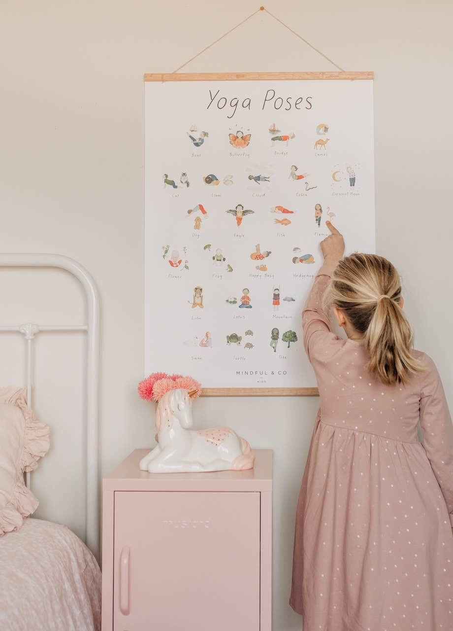 Mindful and Co Kids Yoga Poses Poster for Kids in use by a child