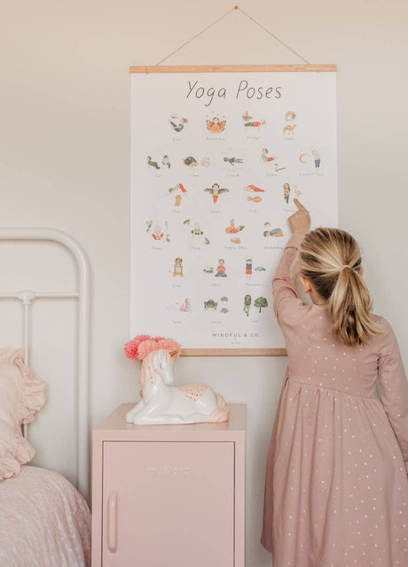 Mindful and Co Kids Yoga Poses Poster for Kids in use by a child