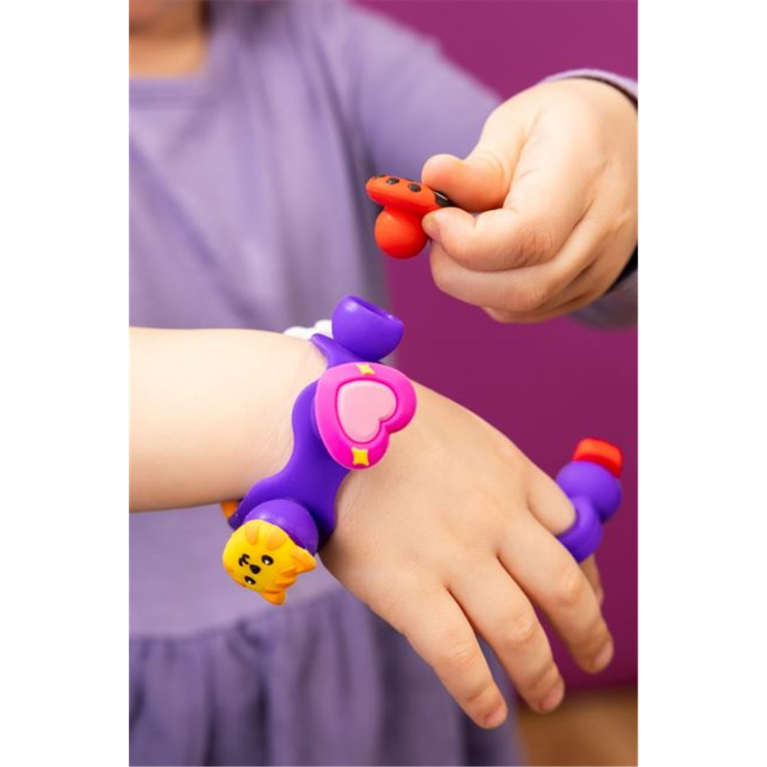 Child playing with the Plip Charms Purple Bracelet