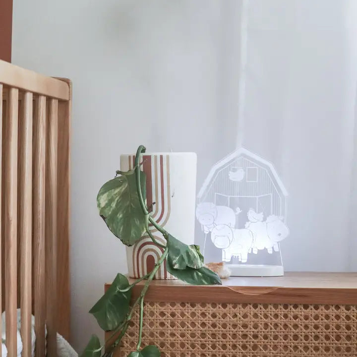 Farm Yard night light glowing on a bedside table