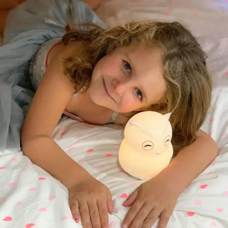 Owl night light shown in the hand for scale