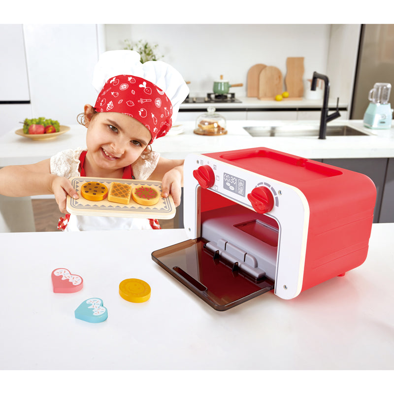 Close-up detail of the Hape My Baking Oven Magic Cookies play kitchen