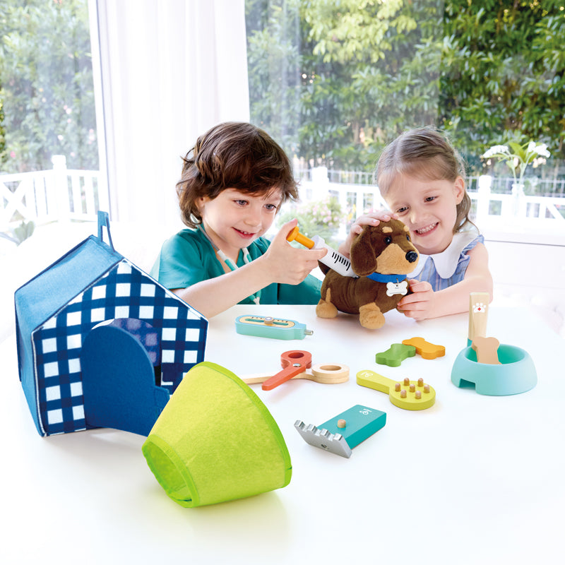 Close-up detail of the Hape Puppy Care Clinic Vet Set wooden toy