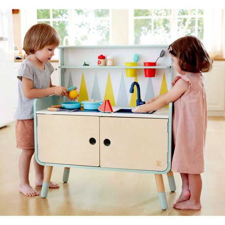 Close-up detail of the Hape Switch 'n Store Play Kitchen wooden play kitchen