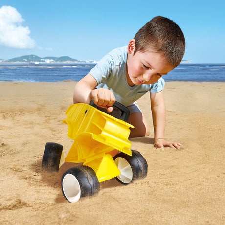 Close-up detail of the Hape Dump Truck, Yellow wooden toy