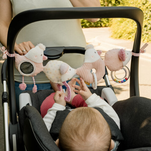 Fehn Pram Chain Fairy Friends shown in scale against a hand