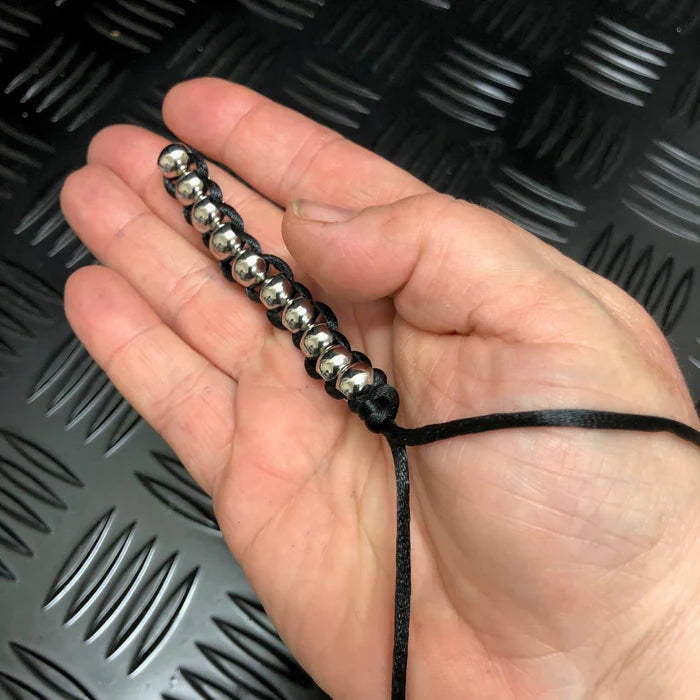 Close-up detail of the HAND Caterpillar Fidget Black Cord