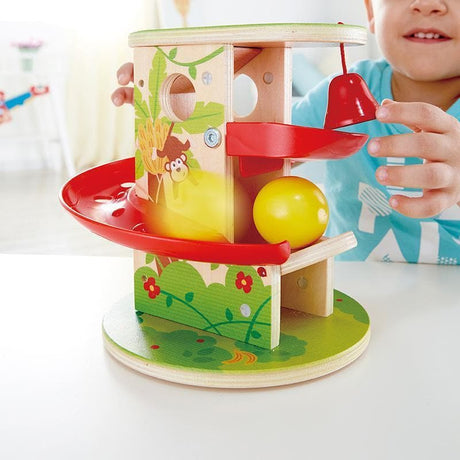 Close-up detail of the Hape Jungle Press & Slide (Ball Run) wooden educational toy