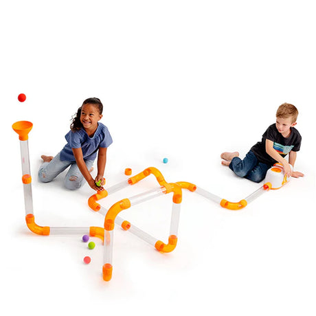 Two children playing with a ir toobz expansion pack on a white background