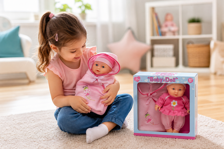 Child playing with the Baby Doll With Carry Bag