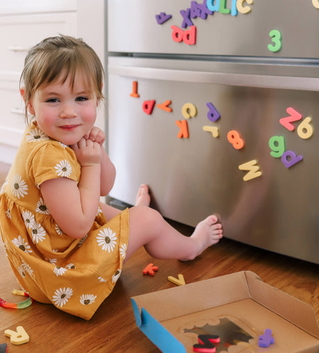 Magnetic Letters & Numbers shown in the hand for scale