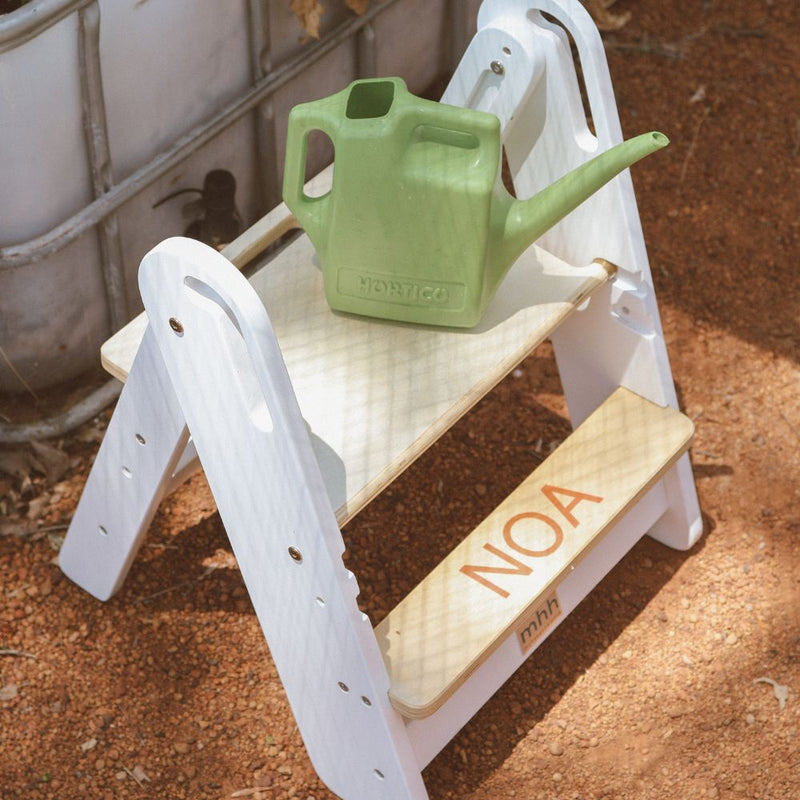 Step Stool open for a child to water plants
